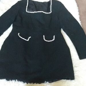 Elegant Black Dress with White Trim